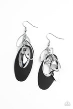 Load image into Gallery viewer, Infused with a glassy white rhinestone, shiny silver ovals, a twisted silver plate, and an oversized black frame trickle along a shimmery silver chain, creating a noise-making tassel. Earring attaches to a standard fishhook fitting. 
