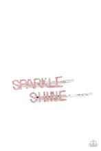 Load image into Gallery viewer, Glassy pink rhinestones spell out &quot;Sparkle,&quot; and &quot;Shine,&quot; across the fronts of two silver bobby pins, creating a sparkly duo.
