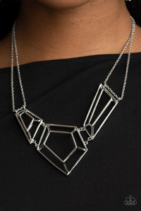 Glistening silver bars connect into edgy 3-dimensional frames below the collar, creating a bold geometric statement piece. Features an adjustable clasp closure. 