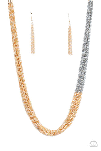 Sections of glistening gold chains collide with shimmery silver chains below the collar, linking into dramatic layers for an edgy effect. Features an adjustable clasp closure.