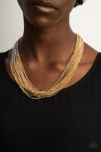 Load image into Gallery viewer, Sections of glistening gold chains collide with shimmery silver chains below the collar, linking into dramatic layers for an edgy effect. Features an adjustable clasp closure.
