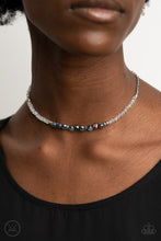 Load image into Gallery viewer, A dainty collection of mismatched oil spill beads ad iridescent crystal-like accents are threaded along an invisible wire around the neck for a stellar look. Features an adjustable clasp closure.
