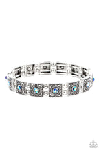 Load image into Gallery viewer, Dotted with iridescent blue rhinestone centers, studded silver frames alternate with pairs of dainty silver beads along stretchy bands, creating a stellar centerpiece around the wrist.
