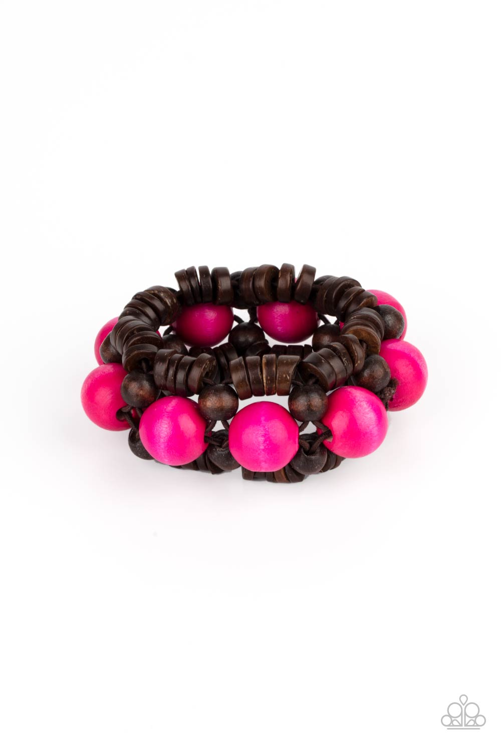 Oversized pink wooden beads, rustic brown wooden beads, and dainty wooden discs are ornately threaded along braided stretchy bands around the wrist, creating a summery centerpiece. 