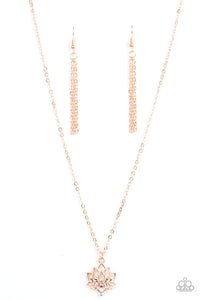 A shiny rose gold lotus blooms along a dainty rose gold chain, creating a whimsical pendant below the collar. Features an adjustable clasp closure. 