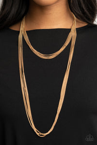 Row after row of dainty gold chains layer down the chest for a boldly tiered look. Features an adjustable clasp closure.