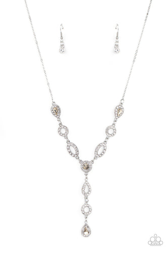 White rhinestone encrusted oval and teardrop silver frames delicately link with matching topaz rhinestone dotted frames below the collar. Matching frames trickle from the center, creating an elegant extended pendant. Features an adjustable clasp closure.