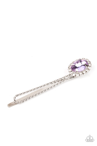 Bordered in a ring of glassy white rhinestones, an oval purple gem adorns the corner of a textured silver bobby pin for a glamorous finish.