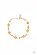 Load image into Gallery viewer, Dipped in a rainbow iridescence, a faceted collection of golden crystal-like beads delicately links around the wrist for a stellar pop of color. Features an adjustable clasp closure.
