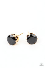 Load image into Gallery viewer, An oversized black rhinestone is nestled inside a pronged gold fitting, creating a timeless statement piece. Earring attaches to a standard post fitting.
