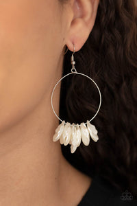 Pearly shell-like beads are threaded along a dainty silver wire, creating a flirtatious beach inspired fringe. Earring attaches to a standard fishhook fitting.