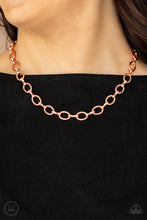 Load image into Gallery viewer, A collection of oversized shiny copper ovals and shiny copper fittings interlock around the neck, creating an intense industrial look. Features an adjustable clasp closure.
