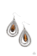 Load image into Gallery viewer, A teardrop tiger&#39;s eye stone swings from the top of a hammered silver frame that links to a larger hammered silver frame, creating a rippling lure. Earring attaches to a standard fishhook fitting.
