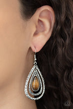 Load image into Gallery viewer, A teardrop tiger&#39;s eye stone swings from the top of a hammered silver frame that links to a larger hammered silver frame, creating a rippling lure. Earring attaches to a standard fishhook fitting.
