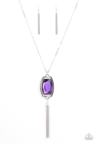 Encased in an antiqued silver frame, an oversized purple gem swings from the bottom of an ornate silver chain. A shimmery silver chain tassel swings from the bottom of the sparkly pendant, creating a regal talisman. Features an adjustable clasp closure.