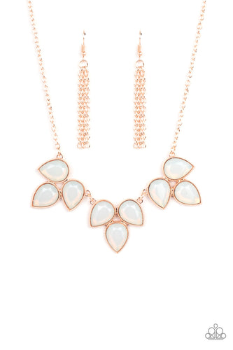 Trios of faceted iridescence, dewy white teardrop beads, encased in studded rose gold casings coalesce into leafy frames that delicate link into an ethereal fringe below the collar. Features an adjustable closure.