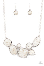 Load image into Gallery viewer, Flecks of iridescent shell-like pieces are encased in glassy white beads. Featuring hammered silver frames, the mismatched frames delicately cluster below the collar for an ethereal fashion. Features an adjustable clasp closure. 
