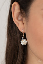 Load image into Gallery viewer, Flecks of iridescent shell-like pieces are encased in glassy white beads. Featuring hammered silver frames, the mismatched frames delicately cluster below the collar for an ethereal fashion. Features an adjustable clasp closure. 

