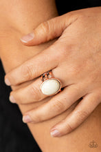 Load image into Gallery viewer, An oval white stone is nestled inside an antiqued copper frame that attaches to layered copper bands, creating a rustic stone centerpiece atop the finger. Features a stretchy band for a flexible fit. 
