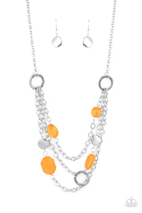 Varying in shape and opacity, glassy Marigold crystal-like beads, asymmetrical silver discs, and textured silver rings haphazardly adorn three silver chains below the collar for a whimsical pop of color. Features an adjustable clasp closure. 