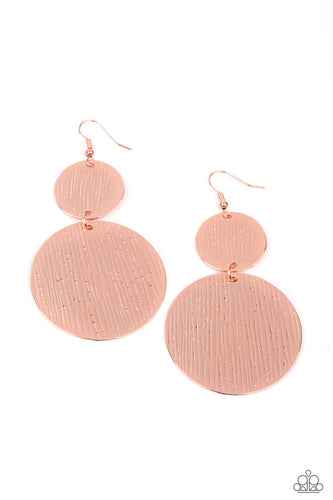 Embossed in tactile linear patterns, two mismatched copper discs link into a glistening lure. Earring attaches to a standard fishhook fitting.