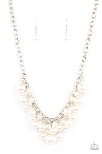 A bubbly collection of classic and oversized white pearls swing from the bottom of a bold silver chain, creating a dramatic fringe below the collar. Features an adjustable clasp closure. 