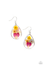 Load image into Gallery viewer, A colorful collection of wildflowers is encased inside a glassy teardrop casing bordered in silver, creating a whimsical display. Earring attaches to a standard fishhook fitting.
