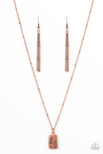 Stamped in a leafy accent, an asymmetrical copper plate is stamped in the word, 