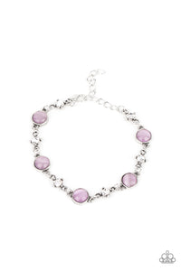 Encased in antiqued silver fittings, dainty white rhinestones and glowing Amethyst Orchid cat's eye stones delicately link around the wrist for a timeless finish. Features an adjustable clasp closure.