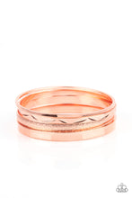 Load image into Gallery viewer, Varying in hammered, textured, and high sheen finishes, a mismatched collection of shiny copper bangles stacks across the wrist for a classic fashion. 
