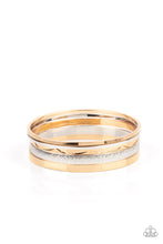 Load image into Gallery viewer, Varying in hammered, textured, and high sheen finishes, a mismatched collection of gold and silver bangles stacks across the wrist for a classic fashion.
