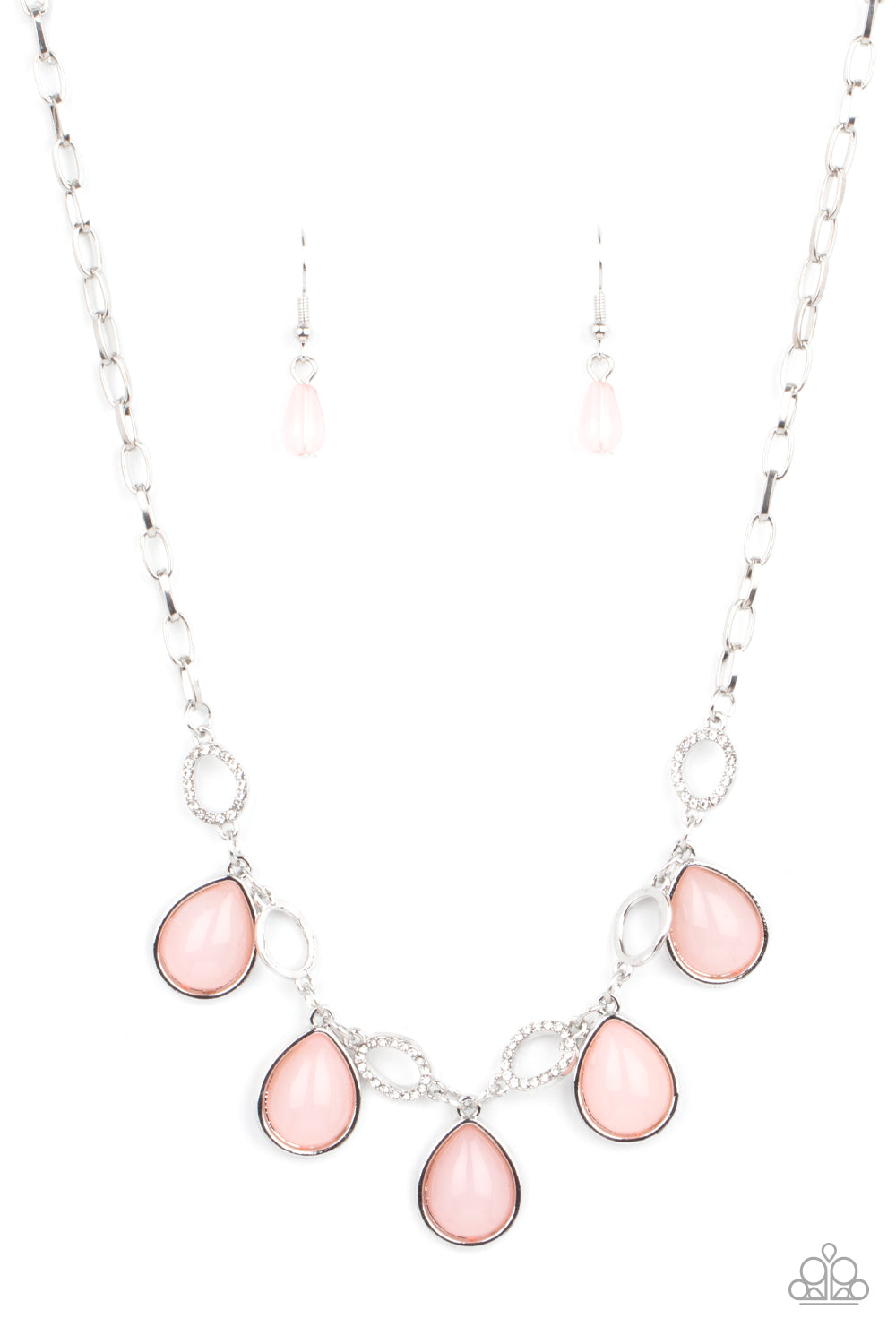 Encased in sleek silver frames, opaque pink teardrop beads link with dainty white rhinestone encrusted silver ovals below the collar, creating a mystical fringe. Features an adjustable clasp closure. 