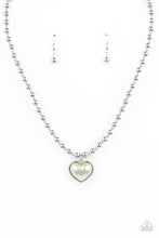 Load image into Gallery viewer, Featuring a pearly Green Ash center, a charming heart pendant glides along a strand of silver beads below the collar for a romantic flair. Features an adjustable clasp closure. 
