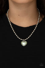 Load image into Gallery viewer, Featuring a pearly Green Ash center, a charming heart pendant glides along a strand of silver beads below the collar for a romantic flair. Features an adjustable clasp closure. 
