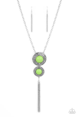 Stamped in vein-like patterns, two oversized silver discs are dotted with bubbly green beaded centers at the bottom of a chunky silver chain. A shimmery silver chain tassel swings from the bottom of the stacked pendant, adding playful movement. Features an adjustable clasp closure. Features an adjustable clasp closure. 