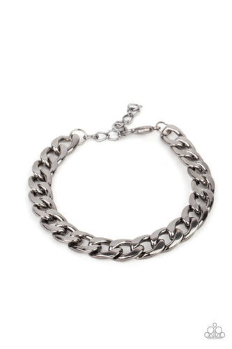 A thick gunmetal strand of curb chain drapes around the wrist for a bold industrial look. Features an adjustable clasp closure. 