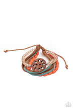 Load image into Gallery viewer, Featuring a wooden floral centerpiece, mismatched strands of orange wooden beads, blue leather, brown suede, and topaz crystal-like beads layer across the wrist for a seasonal flair. Features an adjustable sliding knot closure.
