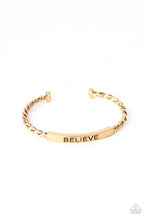 Load image into Gallery viewer, Twisted gold bars attach to a shiny gold plate stamped in the word, &quot;BELIEVE,&quot; creating an inspiring cuff around the wrist.
