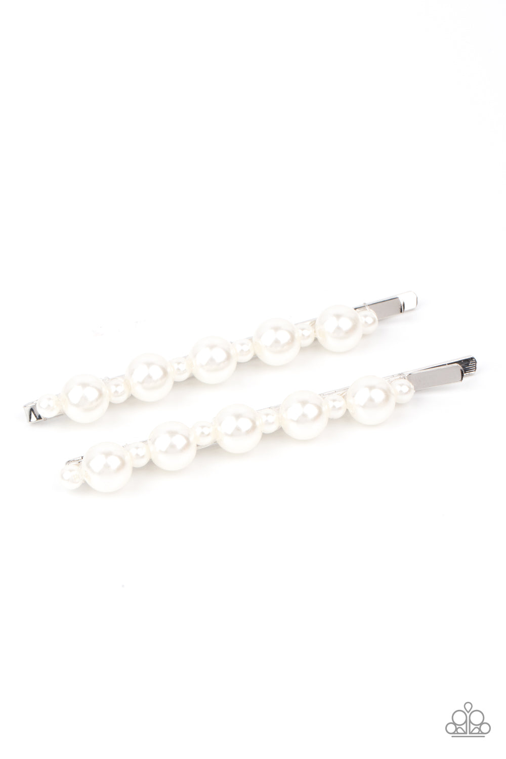 Dainty and classic pearls alternate along a pair of silver bobby pins, creating a bubbly display.