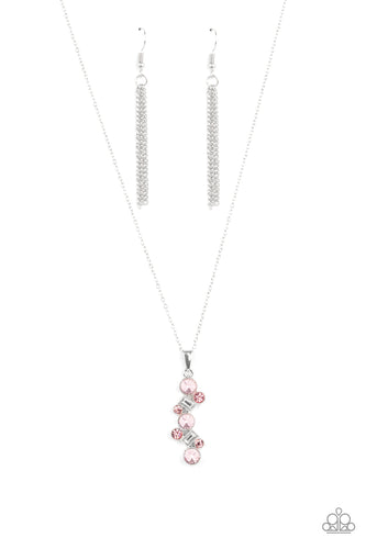 Featuring classic round and regal emerald style cuts, a glittery collection of pink and white rhinestones delicately coalesce into a glamorous pendant below the collar. Features an adjustable clasp closure.
