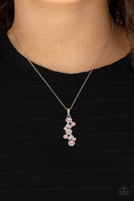 Load image into Gallery viewer, Featuring classic round and regal emerald style cuts, a glittery collection of pink and white rhinestones delicately coalesce into a glamorous pendant below the collar. Features an adjustable clasp closure.
