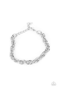 Double linked silver ovals spin into a bold silver chain around the wrist, creating an intense industrial display. Features an adjustable clasp closure.