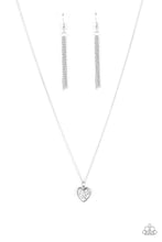 Load image into Gallery viewer, A lovely silver heart frame, encrusted with tiny glittery silver blocks creates a fun 3D pendant that falls below the collar from a dainty silver chain. Features an adjustable clasp closure. 
