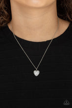 Load image into Gallery viewer, A lovely silver heart frame, encrusted with tiny glittery silver blocks creates a fun 3D pendant that falls below the collar from a dainty silver chain. Features an adjustable clasp closure. 
