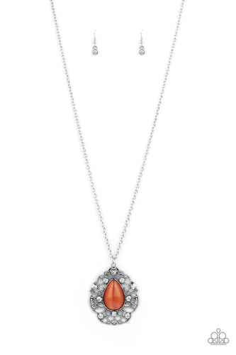 Glassy white rhinestones dot the front of a studded silver filigree frame that blooms out from a teardrop orange cat's eye stone, creating a bewitching pendant at the bottom of a lengthened silver chain. Features an adjustable clasp closure.