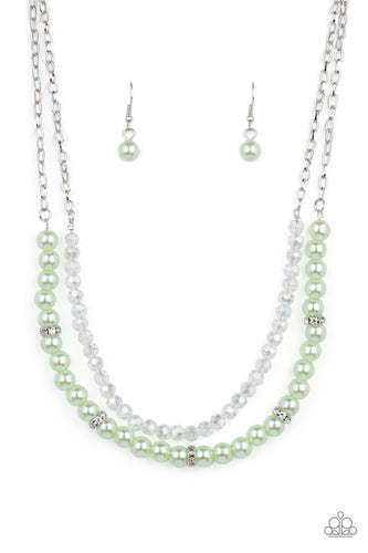 A strand of glassy white crystal-like beads and pearly Green Ash beads and white rhinestone encrusted silver rings layer below the collar, creating a timeless display. Features an adjustable clasp closure.