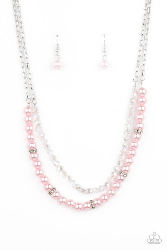 A strand of glassy white crystal-like beads and pearly pink beads and white rhinestone encrusted silver rings layer below the collar, creating a timeless display. Features an adjustable clasp closure.