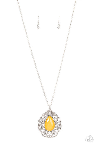 Glassy white rhinestones dot the front of a studded silver filigree frame that blooms out from a teardrop yellow cat's eye stone, creating a bewitching pendant at the bottom of a lengthened silver chain. Features an adjustable clasp closure.