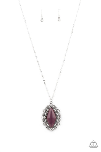 Dotted in glassy white rhinestones, a leafy silver filigree frame blooms from an oversized purple cat's eye stone, creating an enchanted pendant at the bottom of a lengthened silver chain. Features an adjustable clasp closure.