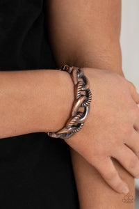 Featuring plain and textured finishes, chunky copper links interconnect into an edgy bangle-like cuff. Features a hinged closure